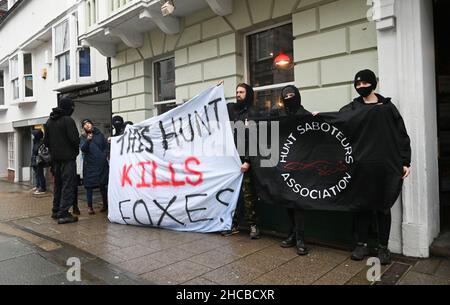Lewes UK 27th December 2021 - Hunt saboteurs at the Southdown and Eridge Hunt parade in Lewes town centre on the Boxing Day bank holiday in the UK : Credit Simon Dack / Alamy Live News Stock Photo