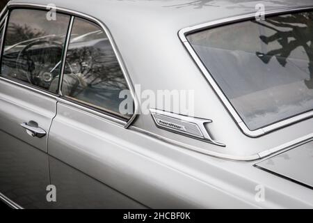 a Ford Taunus 20m TS from the 1960s is parked at the banks of the river Rhine, air outlet at the C pillar, Cologne, Germany.  ein Ford Taunus 20m TS a