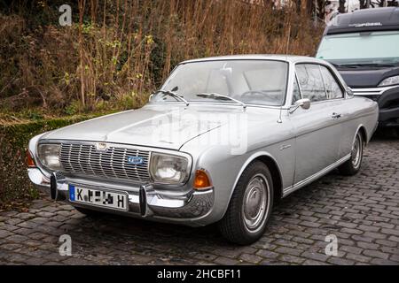 a Ford Taunus 20m TS from the 1960s is parked at the banks of the river Rhine, Cologne, Germany.  ein Ford Taunus 20m TS aus den 1960er Jahren steht a
