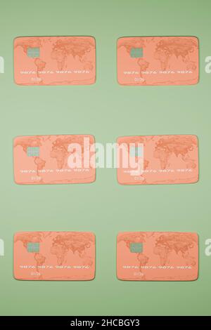 Credit cards arranged side by side on green background Stock Photo