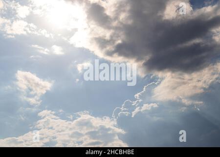 clouds on windy and sunny day on blue sky Stock Photo