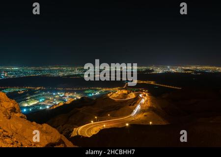 Beautiful night view of the road leading to the Jebel Hafeet mountain summit in Al Ain, United Arab Emirates. Stock Photo