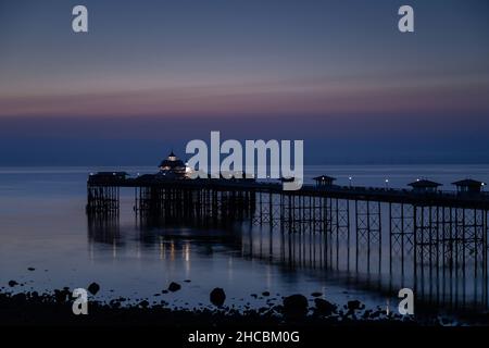 Pier at dawn on Llandudno North Shore, North Wales Stock Photo