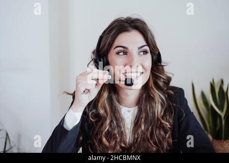 Customer service representative talking on headset at office Stock Photo