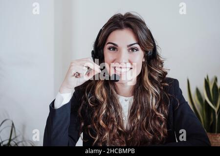 Customer service representative with headset at office Stock Photo