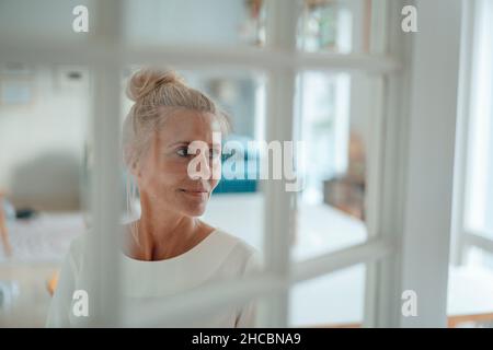Man using tablet PC with woman at home Stock Photo