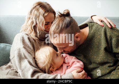 Happy family using tablet PC at home Stock Photo