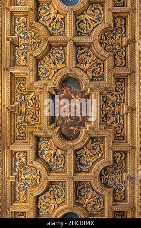 ROME, ITALY - AUGUST 29, 2021: The baroque coffered ceiling in the church Basilica di San Crisogono is and depicts the Glory of Saint Chrysogonus Stock Photo