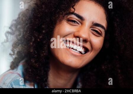 Cheerful woman with curly hair Stock Photo