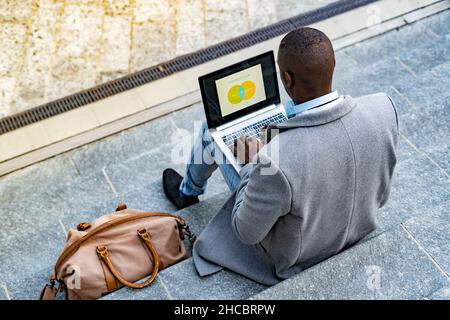Working man making business plan on laptop Stock Photo