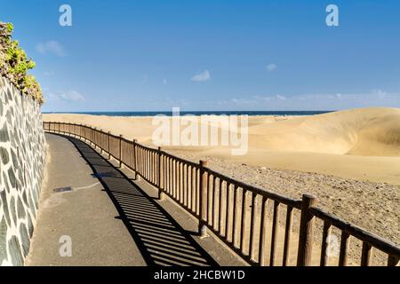 Scenic pathway along dunes in Maspalomas Nature Reserve, Gran Canaria, Canary Islands, Spain Stock Photo