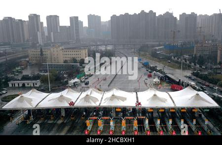 Xi'an, China's Shaanxi Province. 25th Dec, 2021. Aerial photo shows a closed toll station of an expressway in Xi'an, northwest China's Shaanxi Province, Dec. 25, 2021. Credit: Tao Ming/Xinhua/Alamy Live News Stock Photo