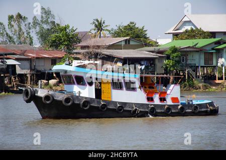 Asian thai worker people sailing barge and tugboat cargo ship delivery shipping in Chao Phraya or chaopraya river from Bangkok go to Ayutthaya old tow Stock Photo