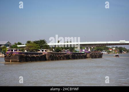 Asian thai worker people sailing barge and tugboat cargo ship delivery shipping in Chao Phraya or chaopraya river from Bangkok go to Ayutthaya old tow Stock Photo