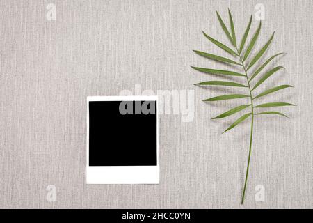 Empty polaroid picture on a grey background. Stock Photo