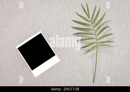 Empty polaroid picture on a grey background. Stock Photo