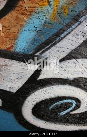 Hand painted graffiti with black and blue spray paint. Stock Photo
