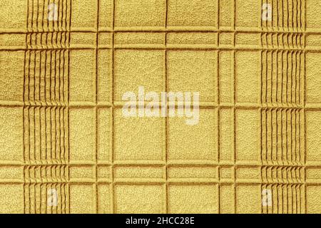 Texture of genuine checkered leather, yellow color. Abstract pattern for background, copy space Stock Photo