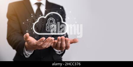 Business man hold,holding cloud computing data and security on global networking,Padlock and cloud icon. Technology of business.Cybersecurity and info Stock Photo