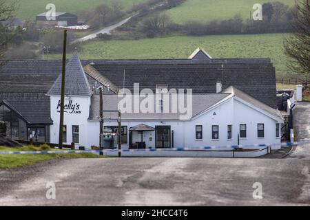 PSNI tape at the closed Radergan Road overlooking Kellys Inn on the Omagh Road area of Garvaghy after three men were killed at around 1.50am on Monday at the Omagh road area and involved a car and a lorry. Picture date: Monday December 27, 2021. Stock Photo