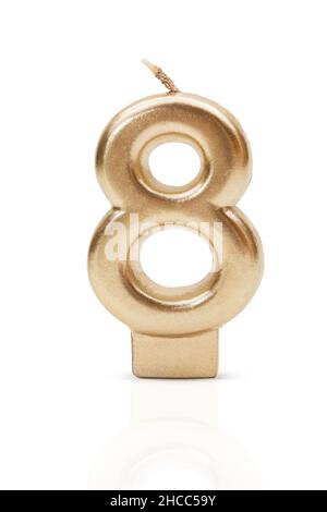 Gold number 8. Candle on white isolated background. International Women's Day, Birthday, Anniversary. Copy space Stock Photo