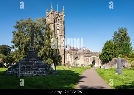 Sun shines on the traditional gothic tower of St Andrew's Church in Chew Magna village, Somerset. Stock Photo