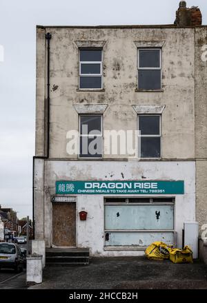 A closed-down takeaway restaurant on the seafront Esplanade of Burnham-on-Sea in Somerset. Stock Photo