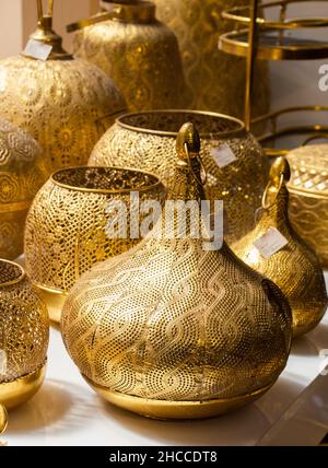 Vertical shot of many old golden ottoman kitchenware on the table Stock Photo