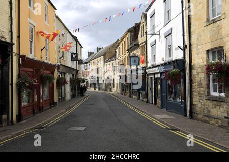 Shops and street view of Back Row, Hexham town, Northumberland, England Stock Photo