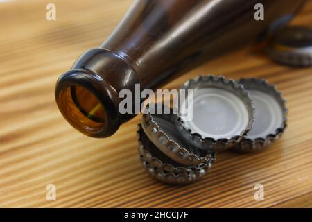 Neck of an empty beer bottle with a bottle cap Stock Photo