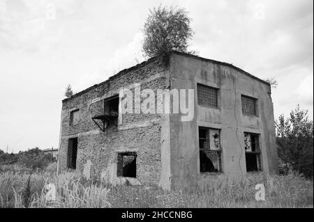 an old abandoned building on field Stock Photo