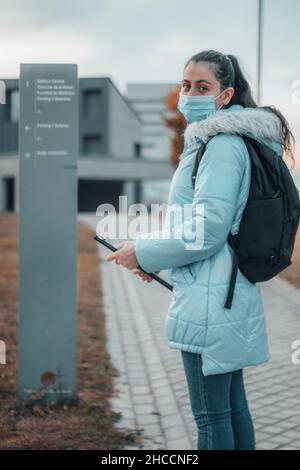 Teenager medical student with mask waiting for exam in campus Stock Photo