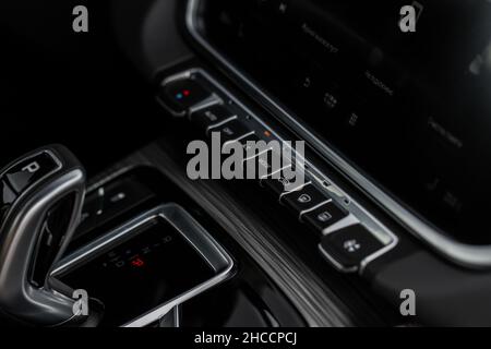 Modern car media display in the interior of the car. Touchscreen monitor on the dashboard of the modern car. Stock Photo