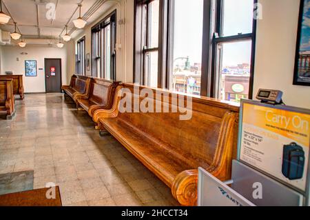 passenger benches in train station lobby Stock Photo