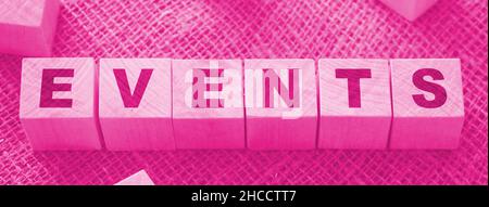 Event Word Written on Wooden Cube on a burlap background. Holiday special or memorial dates celebration concept. Stock Photo