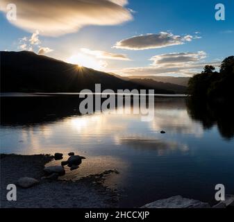 A lenticular cloud hanging over Grasmere, Lake District National Park, Cumbria ,UK Stock Photo