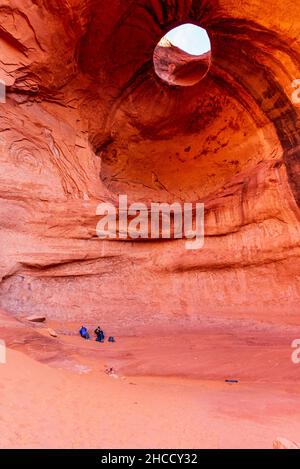 Tourists at the Big Hogan Formation in Monument Valley, Arizona Stock Photo