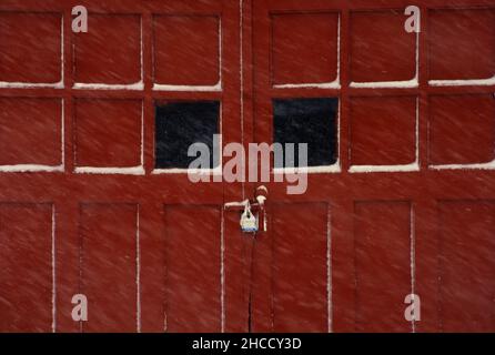 old fashioned garage door in a snow storm Windsor Terrace Brooklyn NYC Stock Photo