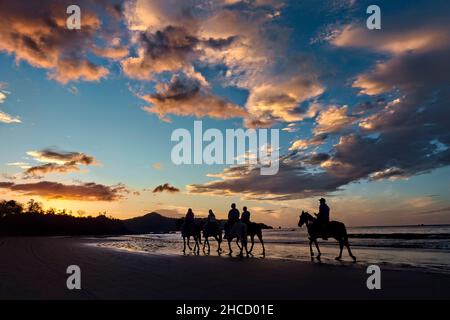 Horse riding on Playa Conchal, Guanacaste, Costa Rica Stock Photo