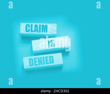 Claim is denied on Wooden Blocks on dark grey background with copyspace. The answer is No. Business financing sponsorship concept. Stock Photo