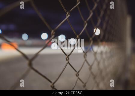 Closeup of a metal wired fence Stock Photo