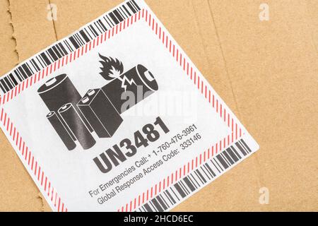 UB3481 hazmat / hazardous materials sticker on a brown manilla shipping ...