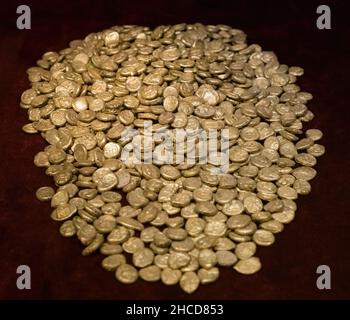 Treasury of ancient Greek coins on dark background Stock Photo