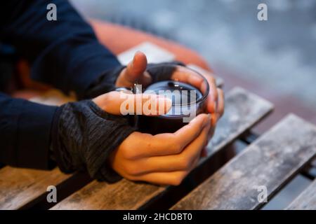 woman hand holding tea cup Stock Photo