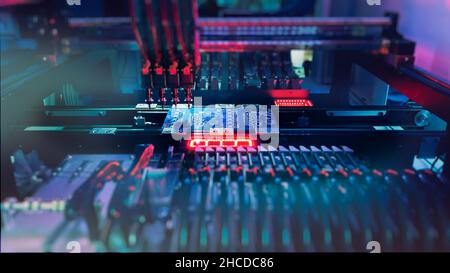 Using of semiconductors for assembly of computer chips and motherboards on robotic AI equipment - Production of computer Chips at Semiconductor Crisis. Assembly of electronic chips at factory. Stock Photo