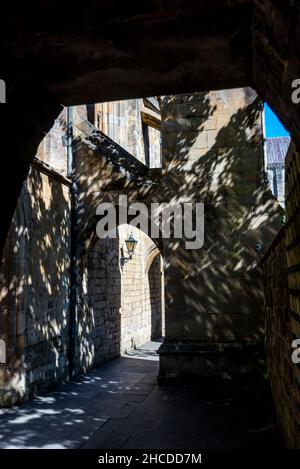 The historic buttresses,with their arched passageways,support either side of the Cathedral,here under blue skies,on a warm summer afternoon. Stock Photo