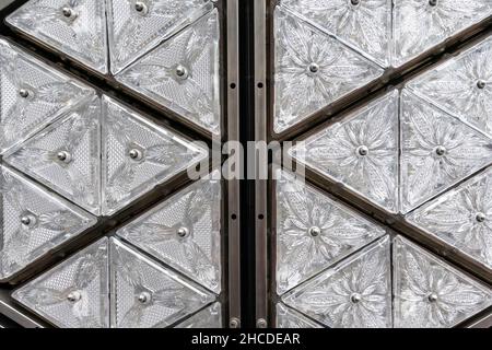 New York, NY - December 27, 2021: Preparation of New Year’s Eve Ball by installation of panels with new Waterford crystals named Gift of Wisdom on top of One Times Square. Side by side panels with 2021 crystals on the left (not replaced yet) and new 2022 crystals on the right. Stock Photo