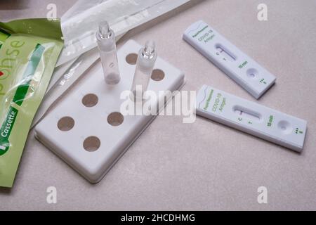 Ottawa, Ontario, Canada - December 25, 2021: Two completed Rapid Response at-home COVID-19 antigen tests show negative results. Stock Photo