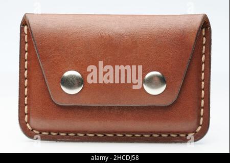 Closed brown leather cardholder front view isolated on studio background Stock Photo