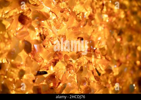 Amber mosaic, luxury wall decoration, closeup background photo with selective soft focus Stock Photo